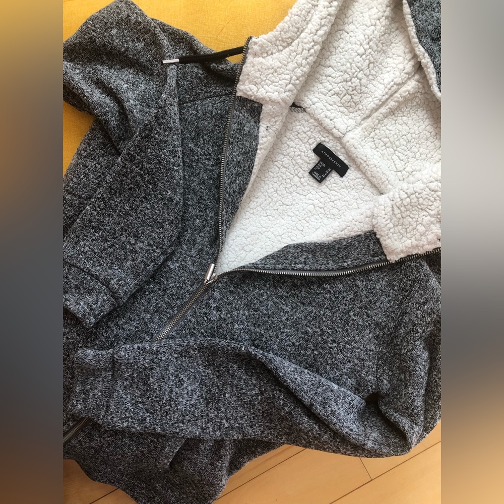 Atmosphere hooded jacket open front zipper. Warm. Used three seasons.
